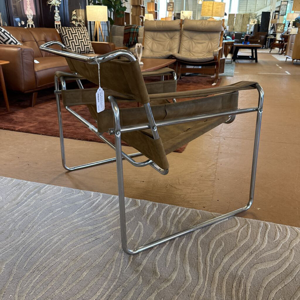 Brown chair with metal frame in a showroom setting