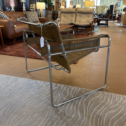 Brown chair with metal frame in a showroom setting