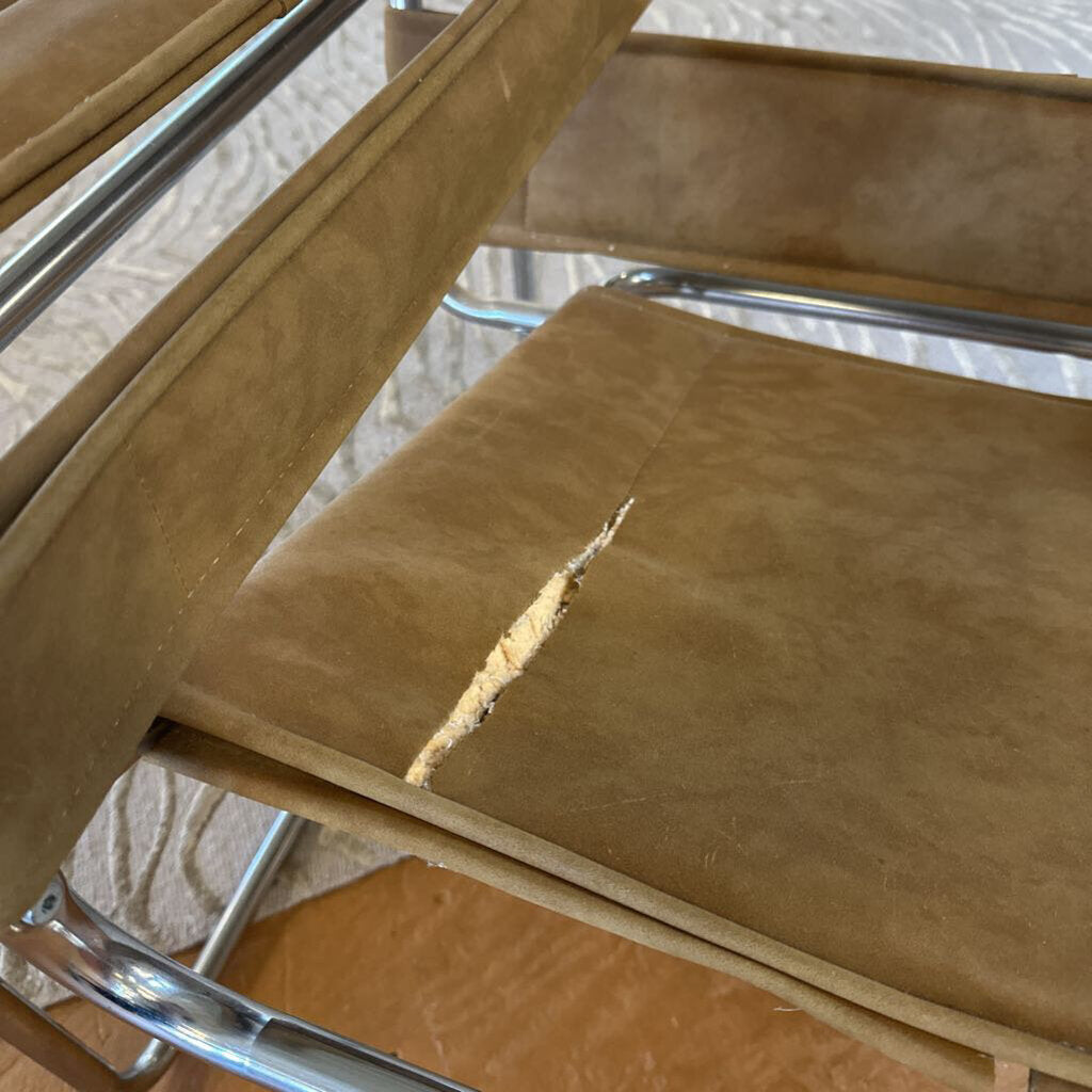 Brown chair with a large scratch on the seat