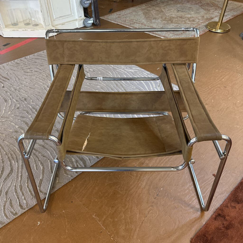 Brown step stool with metal frame on a wooden floor