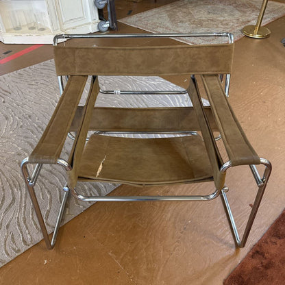 Brown step stool with metal frame on a wooden floor