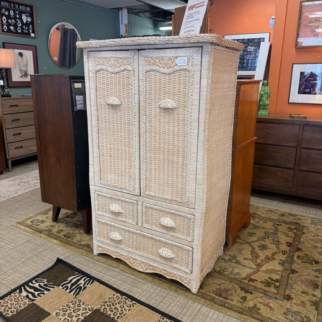 Wicker armoire in a room with other furniture and decor