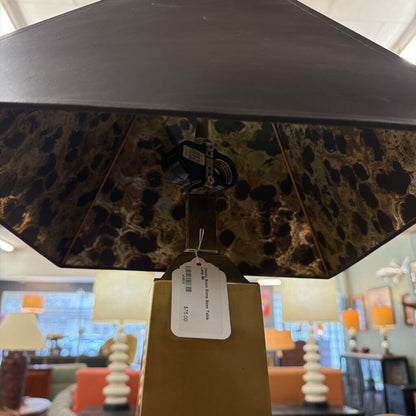 Decorative lamp with leopard print shade and price tag in a store setting