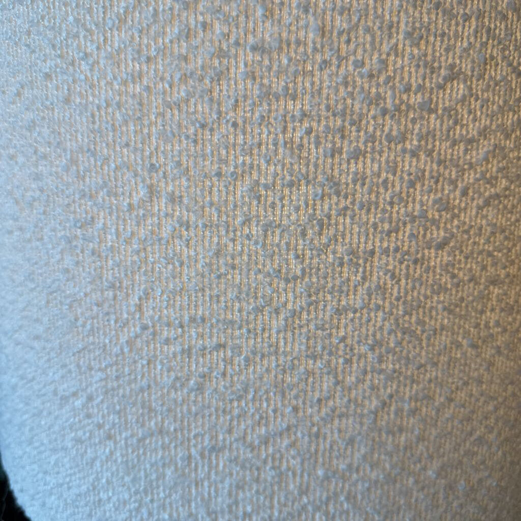 Close-up of textured fabric with a gradient from blue to brown.