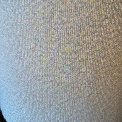 Close-up of textured fabric with a gradient from blue to brown.
