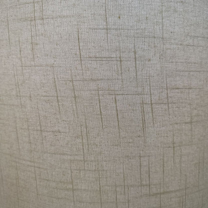 Close-up of textured beige fabric with a subtle pattern