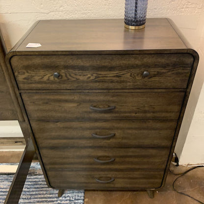 Wooden dresser with multiple drawers in a room setting