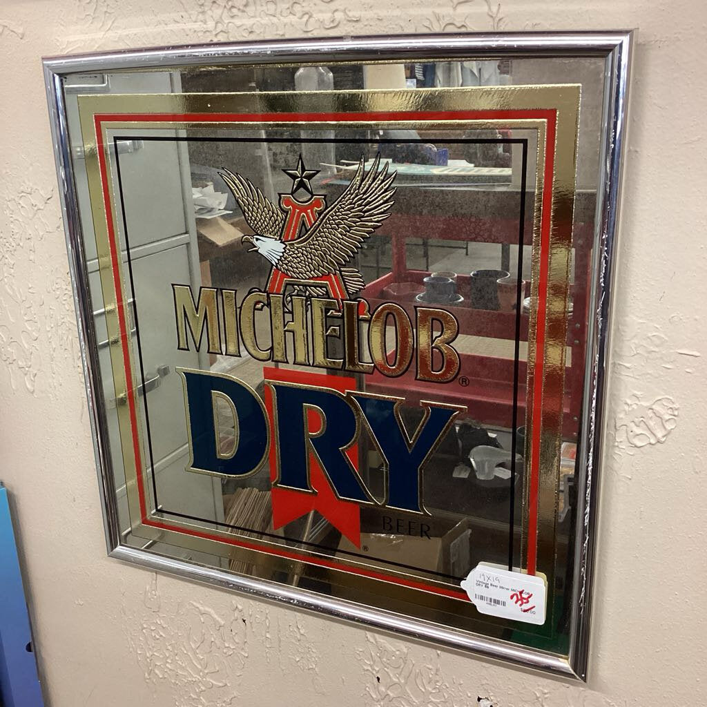 Michelob Dry mirror with brand logo on a textured wall