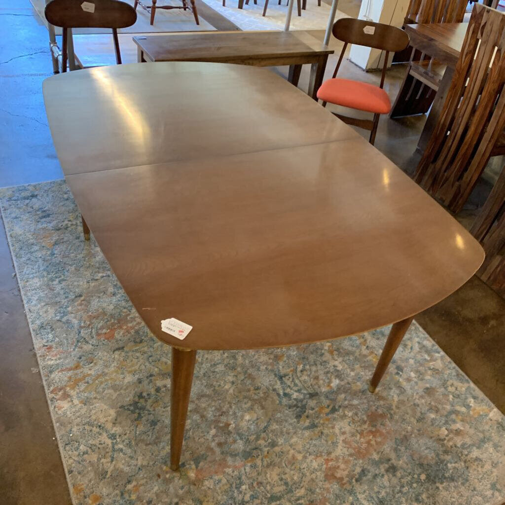 Brown dining table with a single chair in a room setting