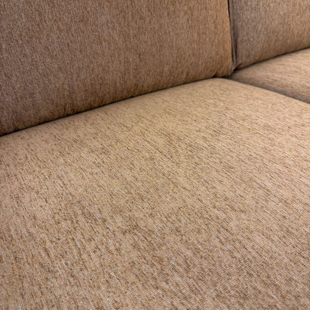 Close-up of a beige textured fabric surface
