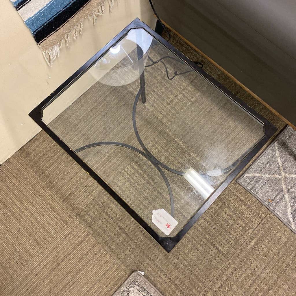 Glass door mat on a carpeted floor