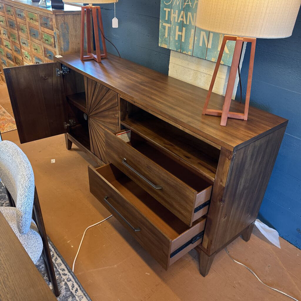 Wooden dresser with multiple drawers in a room setting.