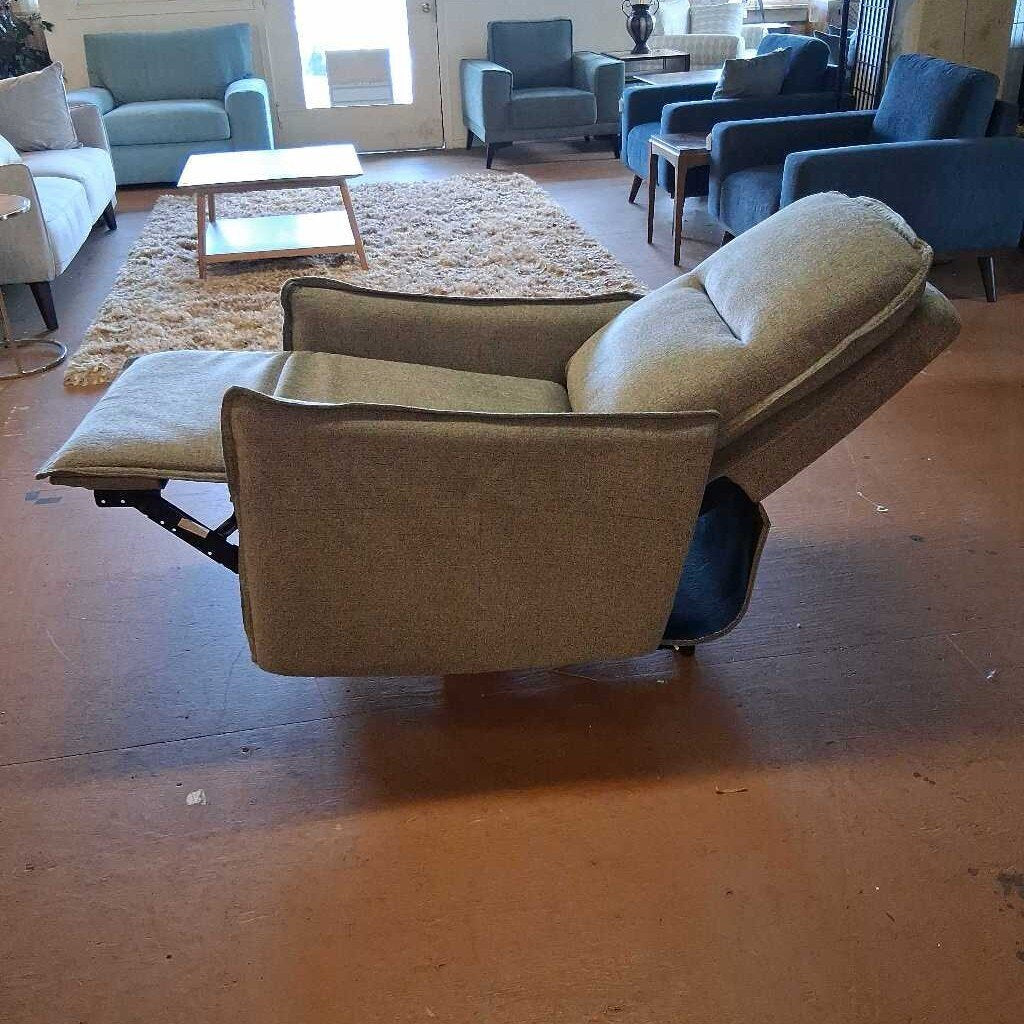Brown recliner chair in a room with other furniture.