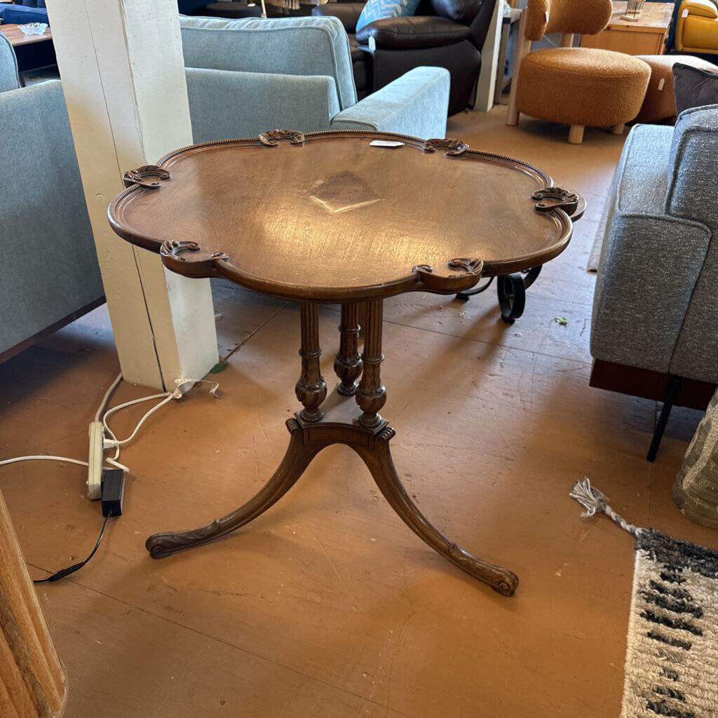 Wooden table in a room with furniture and flooring visible