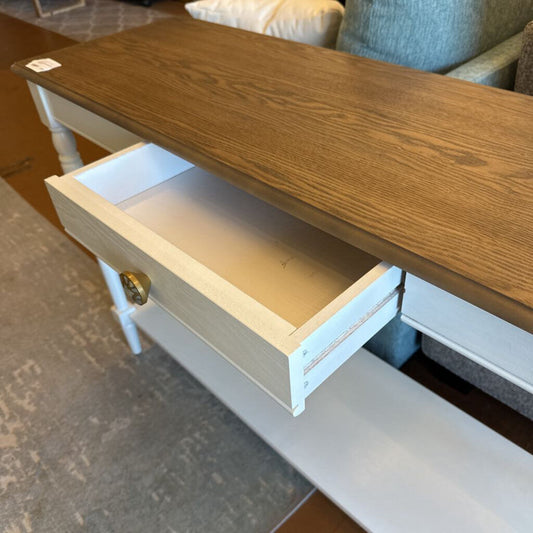 Wooden bench with an open drawer in a room setting