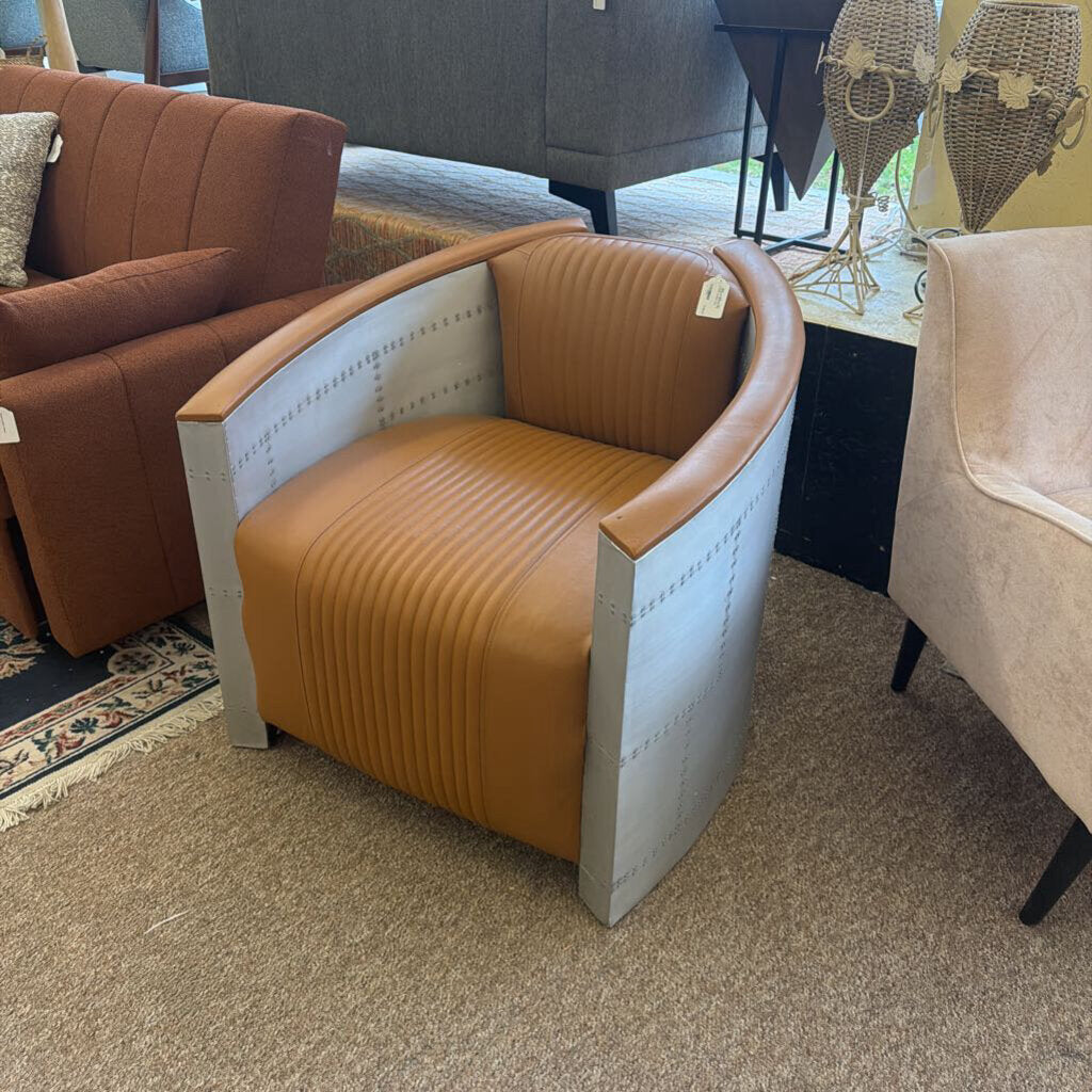 Brown armchair with ribbed texture in a showroom setting