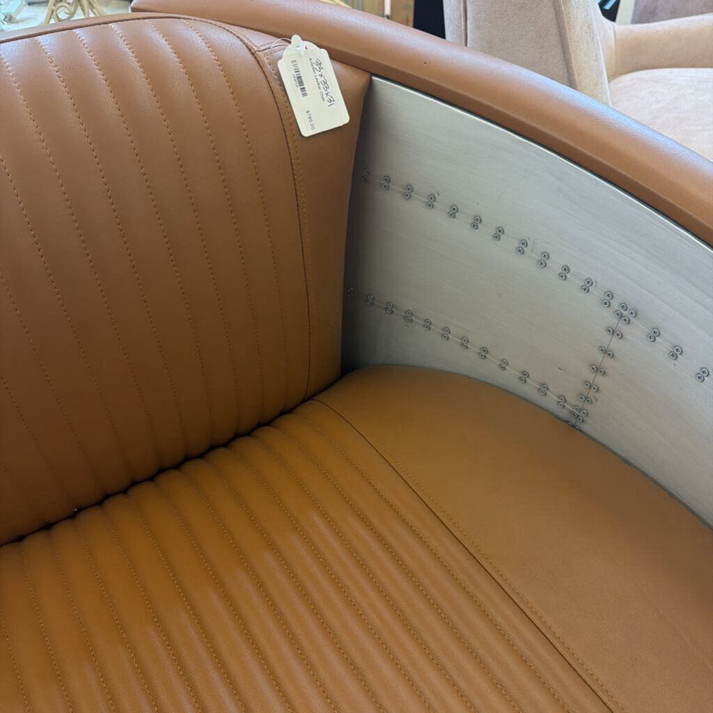 Brown leather car seat with a price tag inside a vehicle.