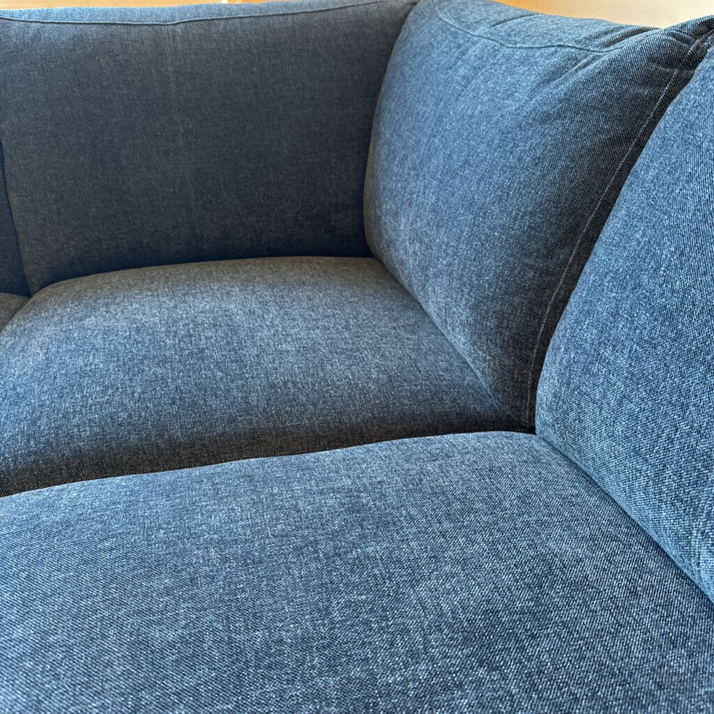 Blue fabric sofa with a textured pattern
