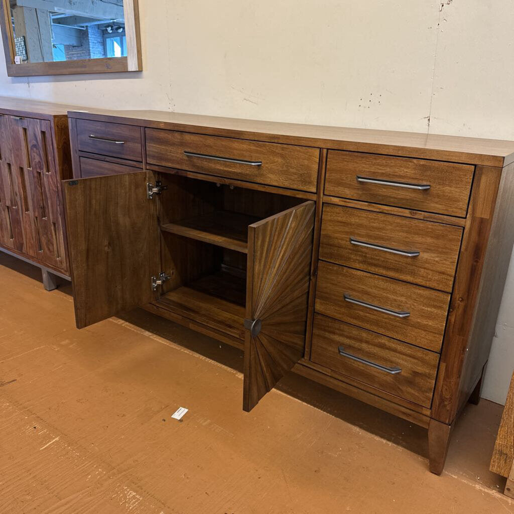 Wooden cabinet with open doors on a brown floor.