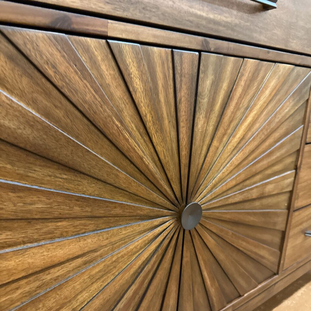 Wooden cabinet with sunburst design and metallic accents