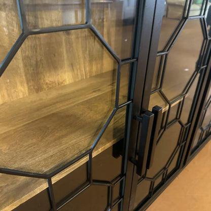 Glass cabinet with black metal frame and wooden shelf