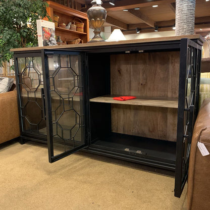 Wooden cabinet with glass doors in a living room setting