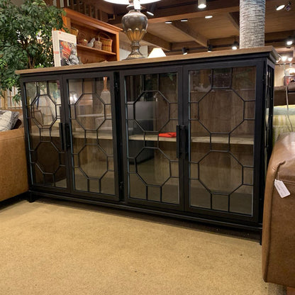 Decorative cabinet with glass doors in a living room setting