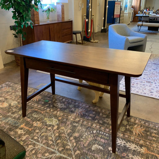 Wooden table in a room with furniture and decor