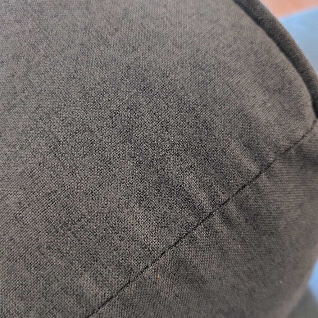 Close-up of a textured gray fabric surface