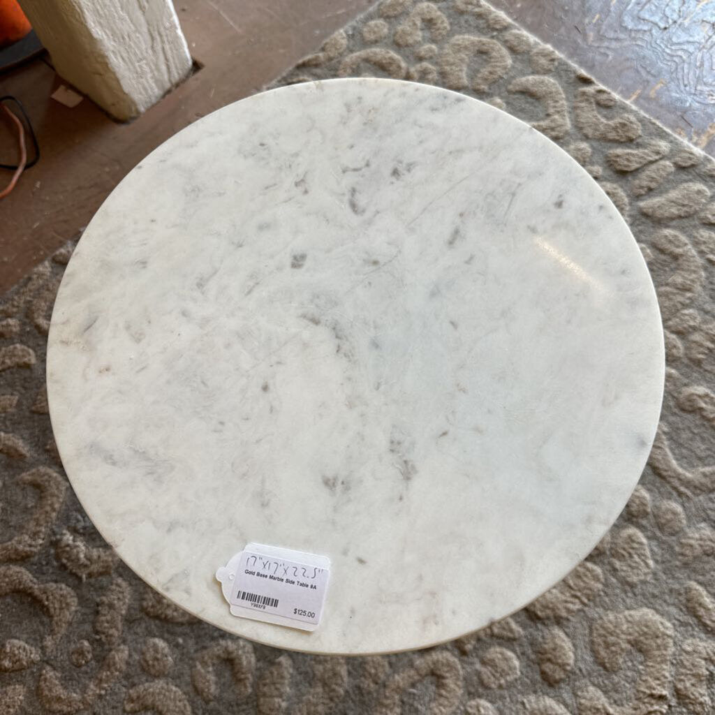 Round marble-like object with a label on a textured surface