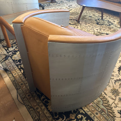 Brown and white chair on a patterned rug