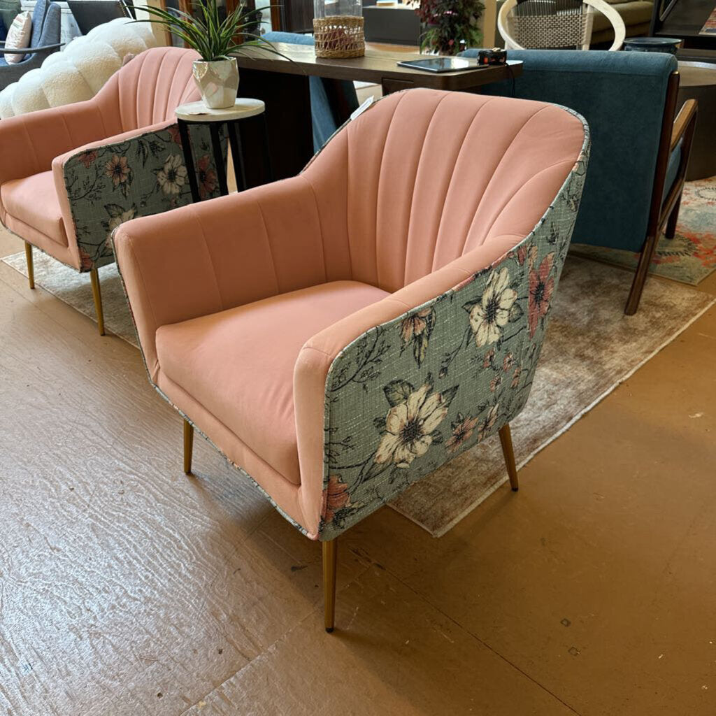 Pink armchair with floral patterned backrest in a room setting