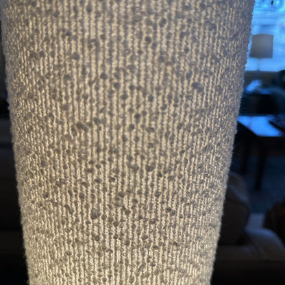 Close-up of textured beige fabric with a blurred background