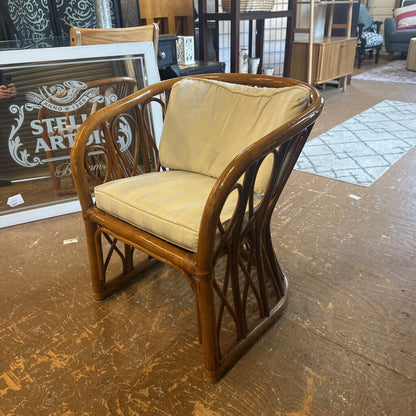 Wooden chair with beige cushion on a wooden floor