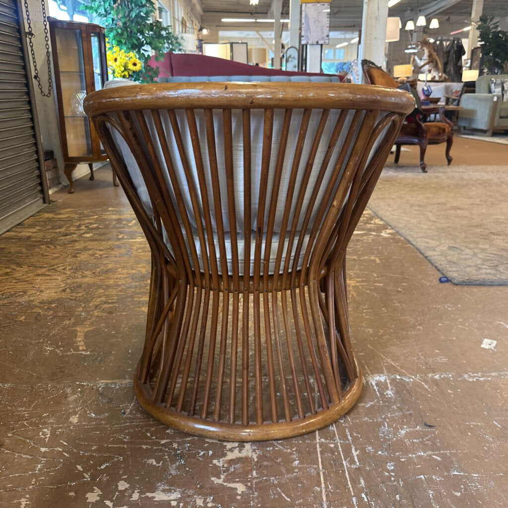 Wooden chair with slatted design on a worn floor