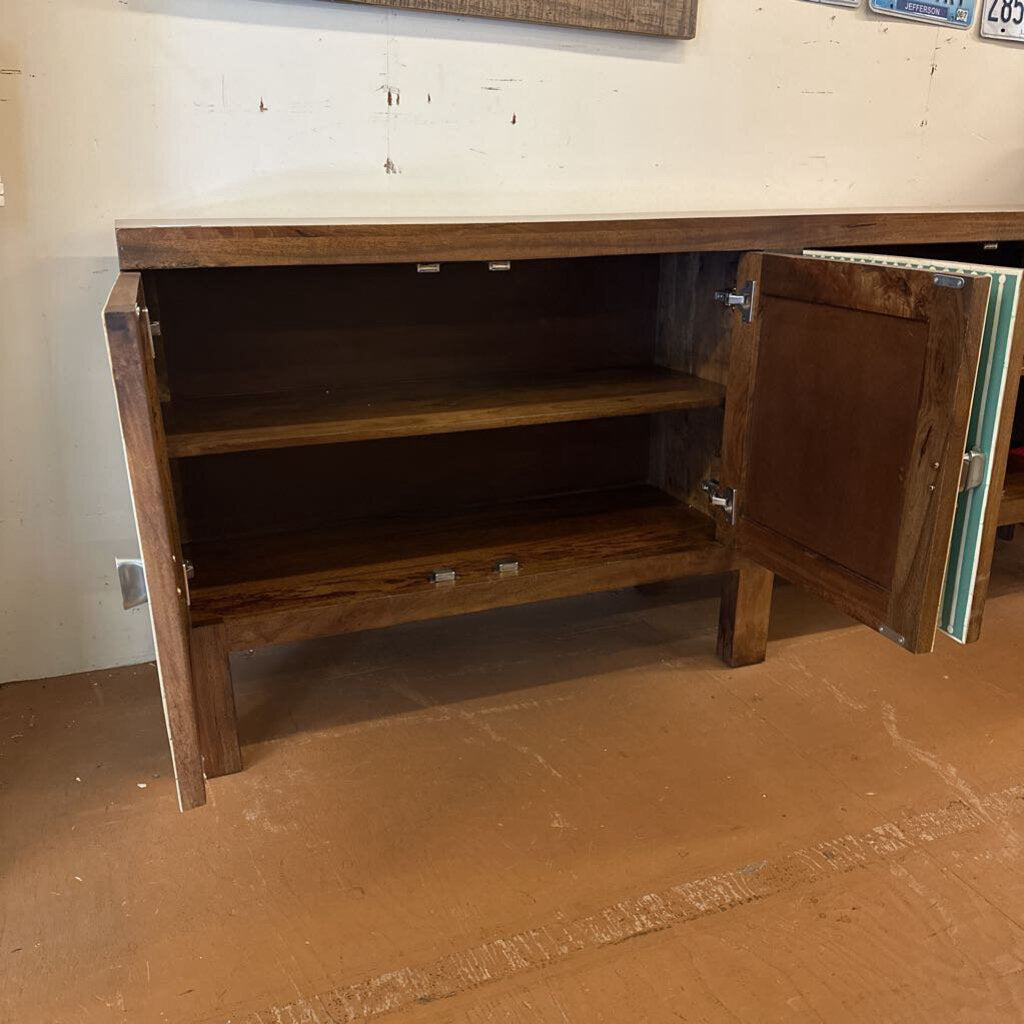 Wooden cabinet with open door on a wooden floor