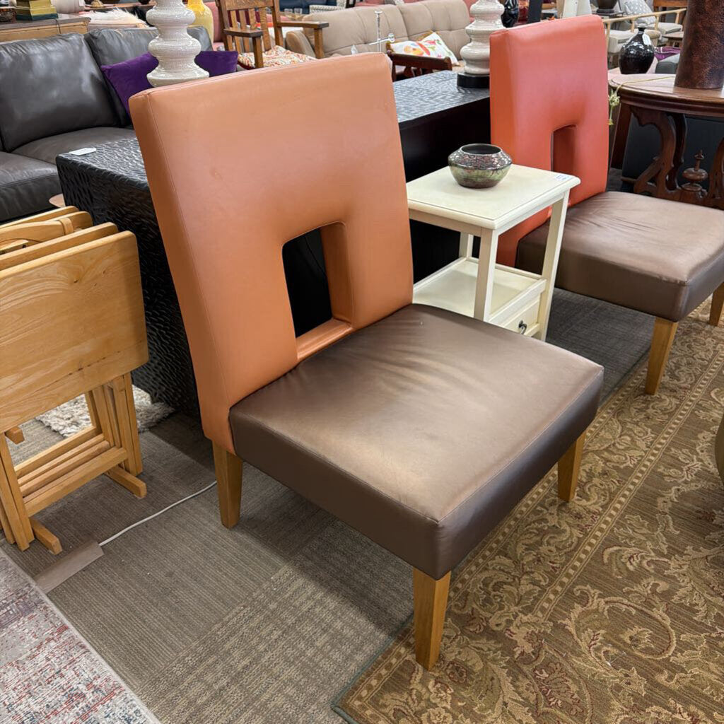 Brown chair with wooden legs in a furniture store setting