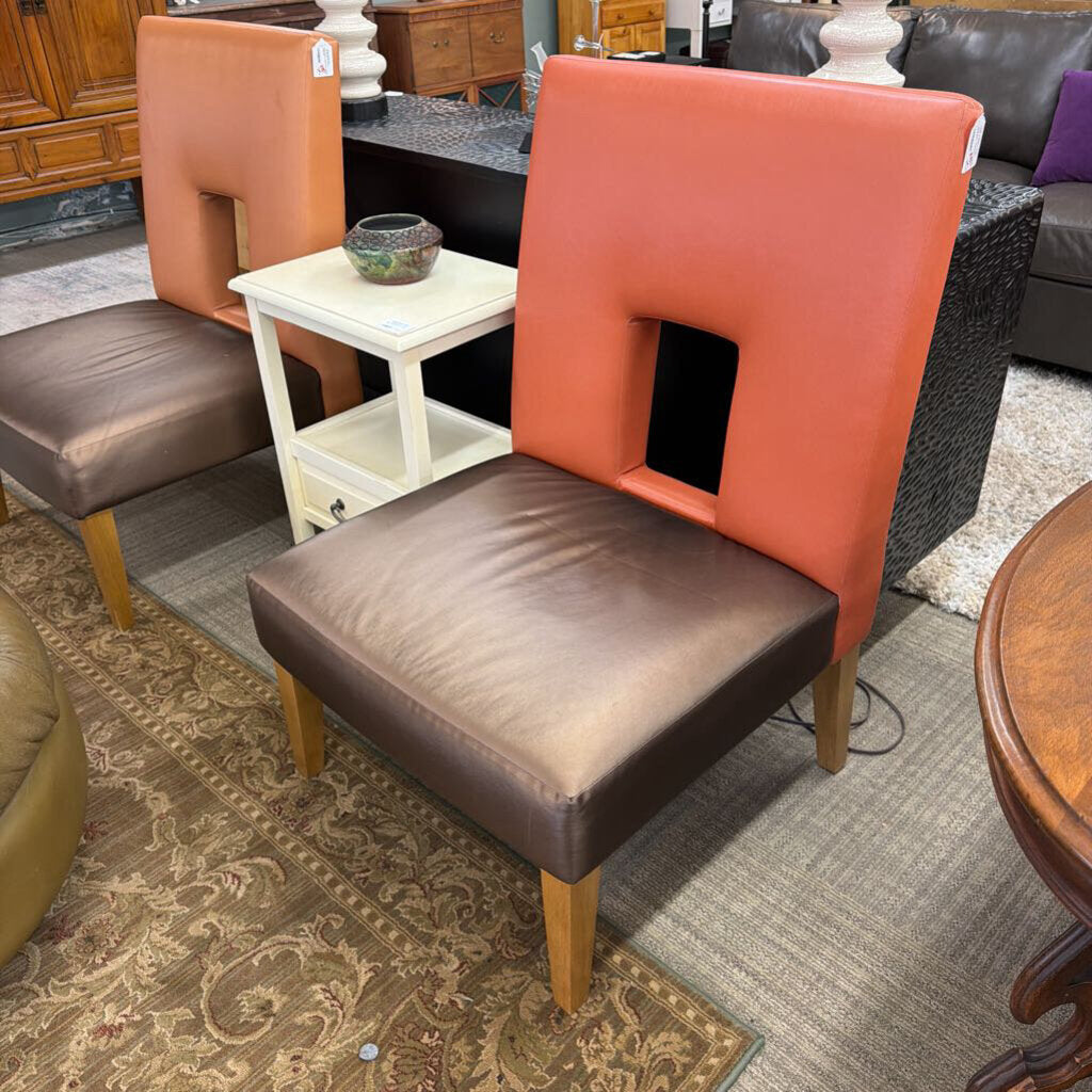 Chair with brown seat and orange backrest in a furniture store setting