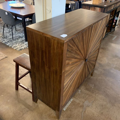 Wooden bar counter with decorative design in a showroom setting