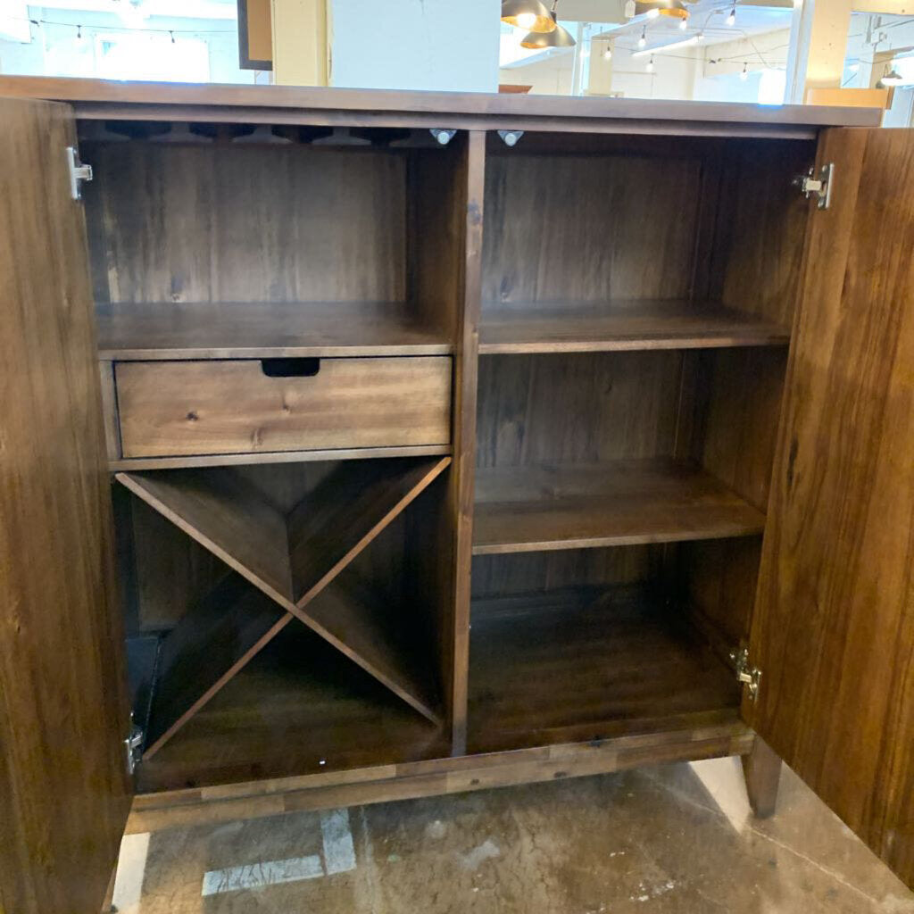 Wooden cabinet with shelves and a drawer in a room setting