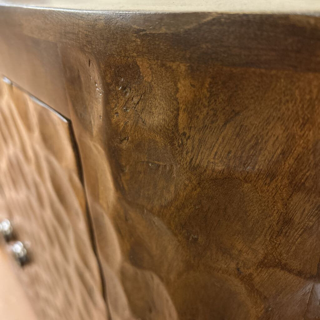 Close-up of a wooden surface with a reflective top