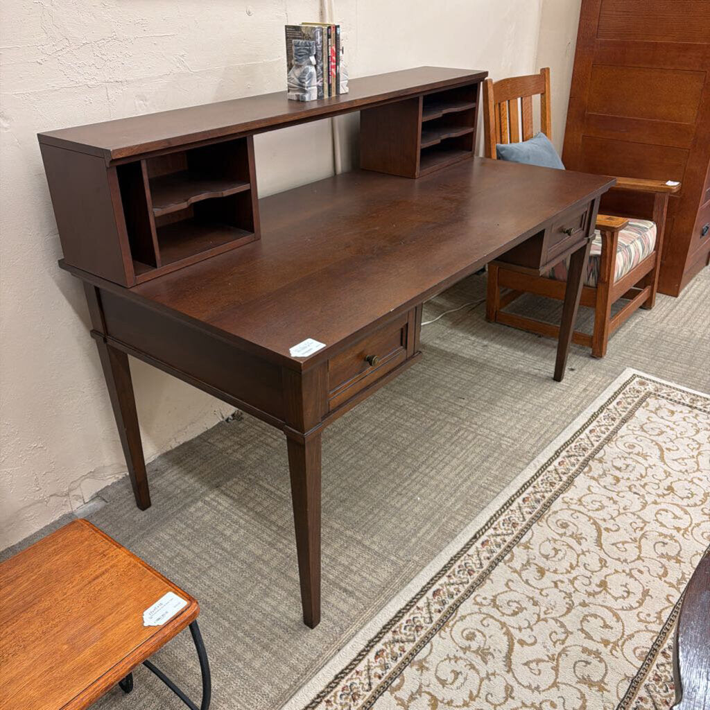 Wooden desk with shelves and drawers in a room setting