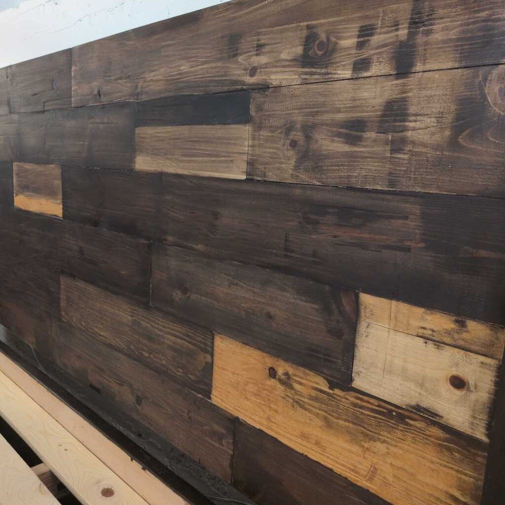 Reclaimed wooden wall panel with a rustic finish