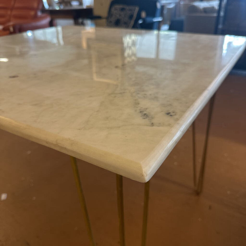 Marble countertop with hairpin legs in a kitchen setting