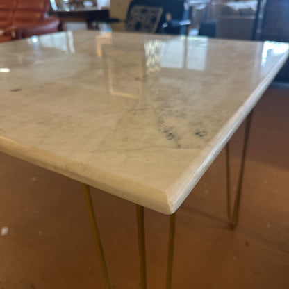 Marble countertop with hairpin legs in a kitchen setting