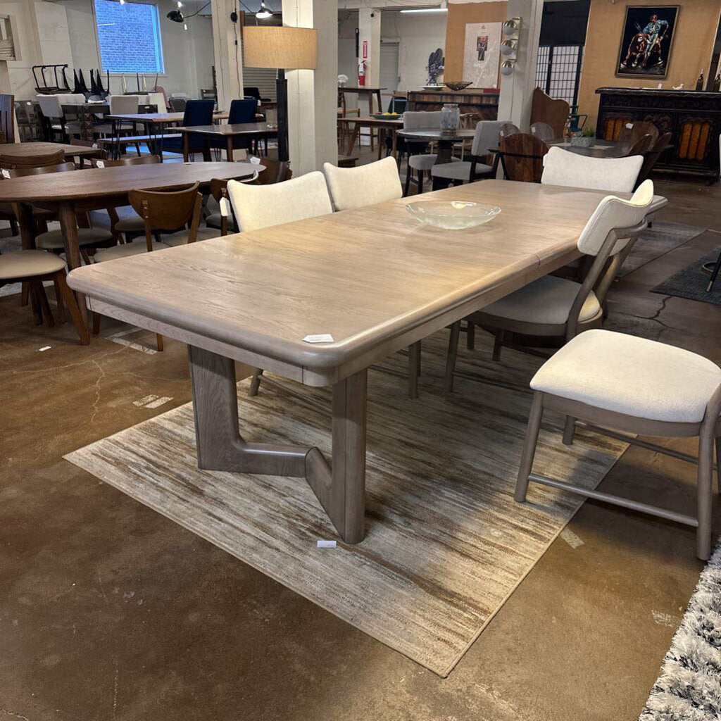 Dining table with chairs in a showroom setting