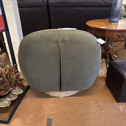 Gray cushion on a wooden floor with a blurred background