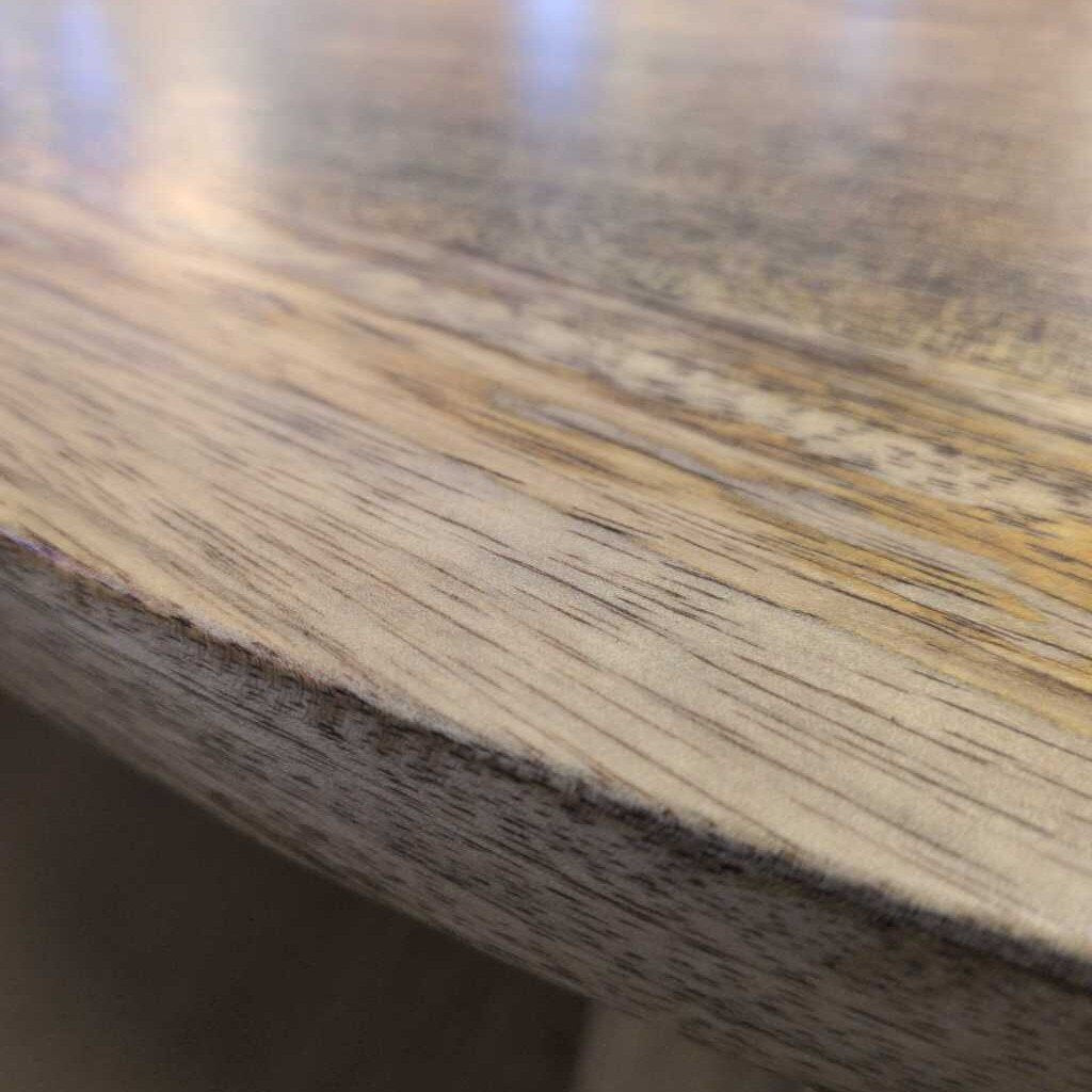 Close-up of a wooden surface with visible grain and texture