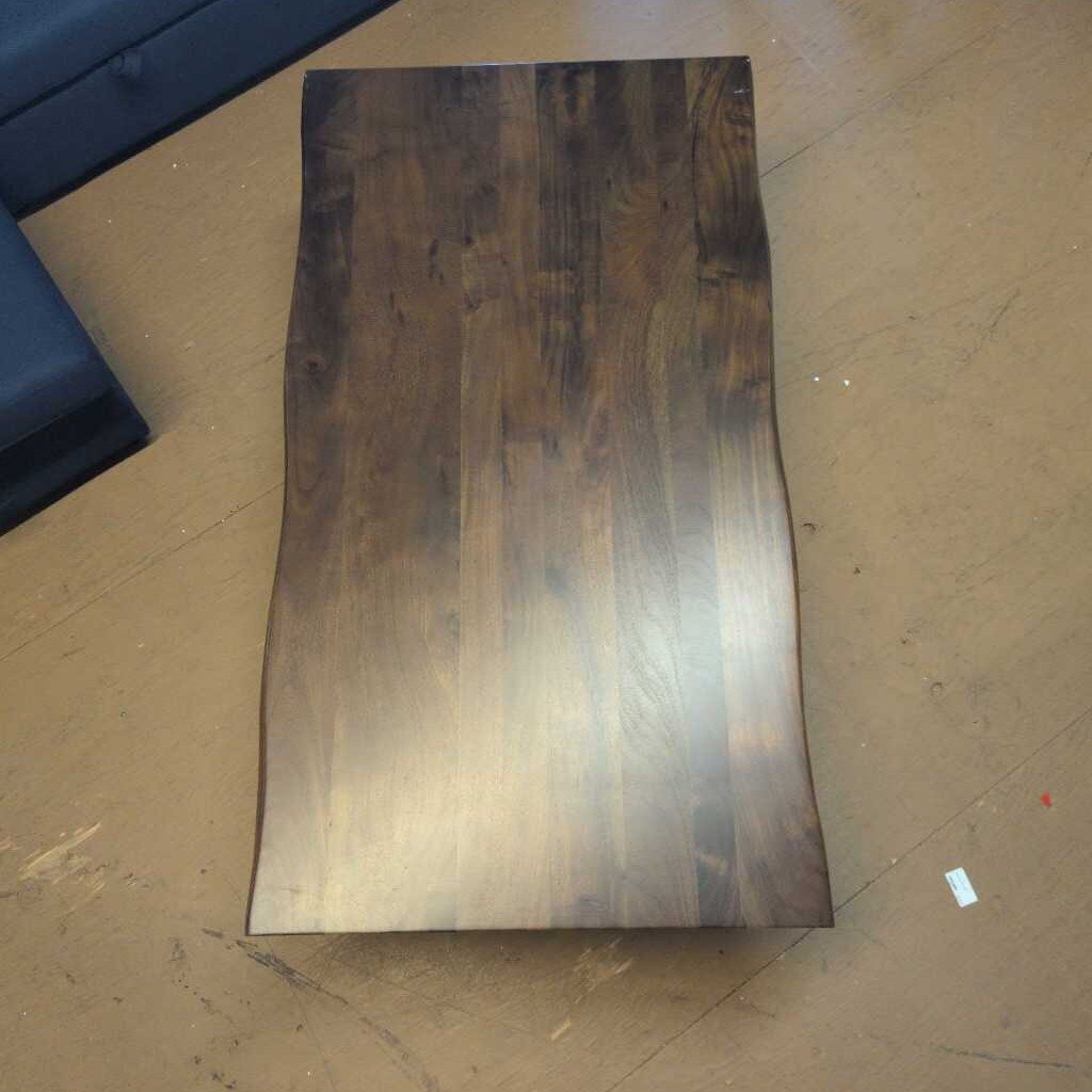 Wooden panel with a dark brown finish on a beige floor