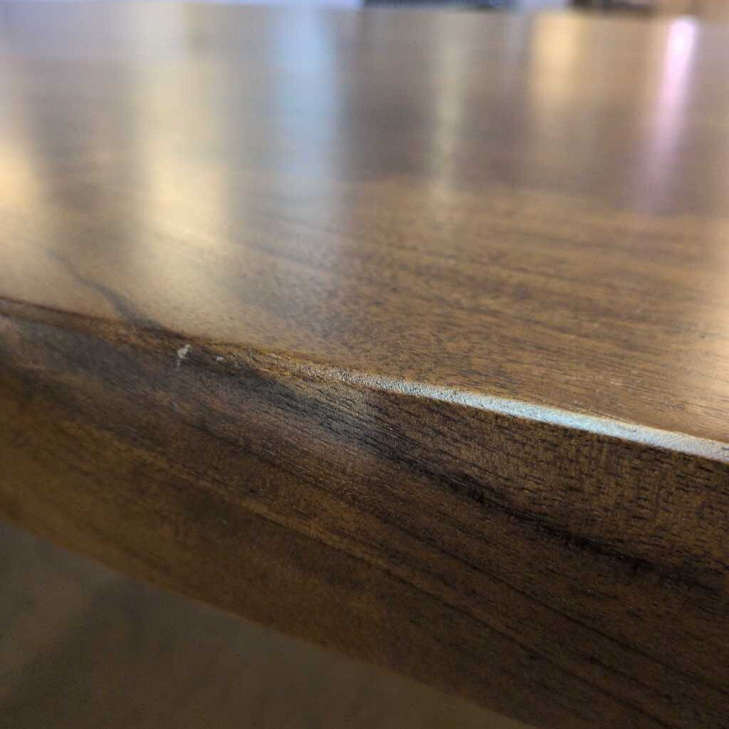 Close-up of a wooden surface with a visible crack